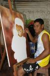 Eliandro Tavares, durante a pintura de curumim com macaco.